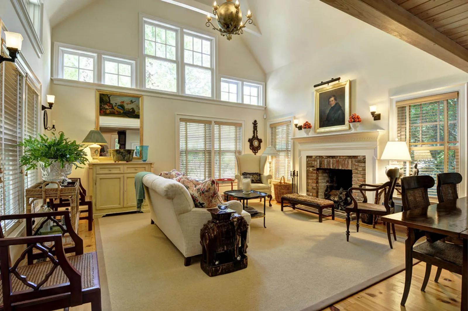 The Hamptons Real Estate | View  | Double height ceiling in living room with fireplace | View 6