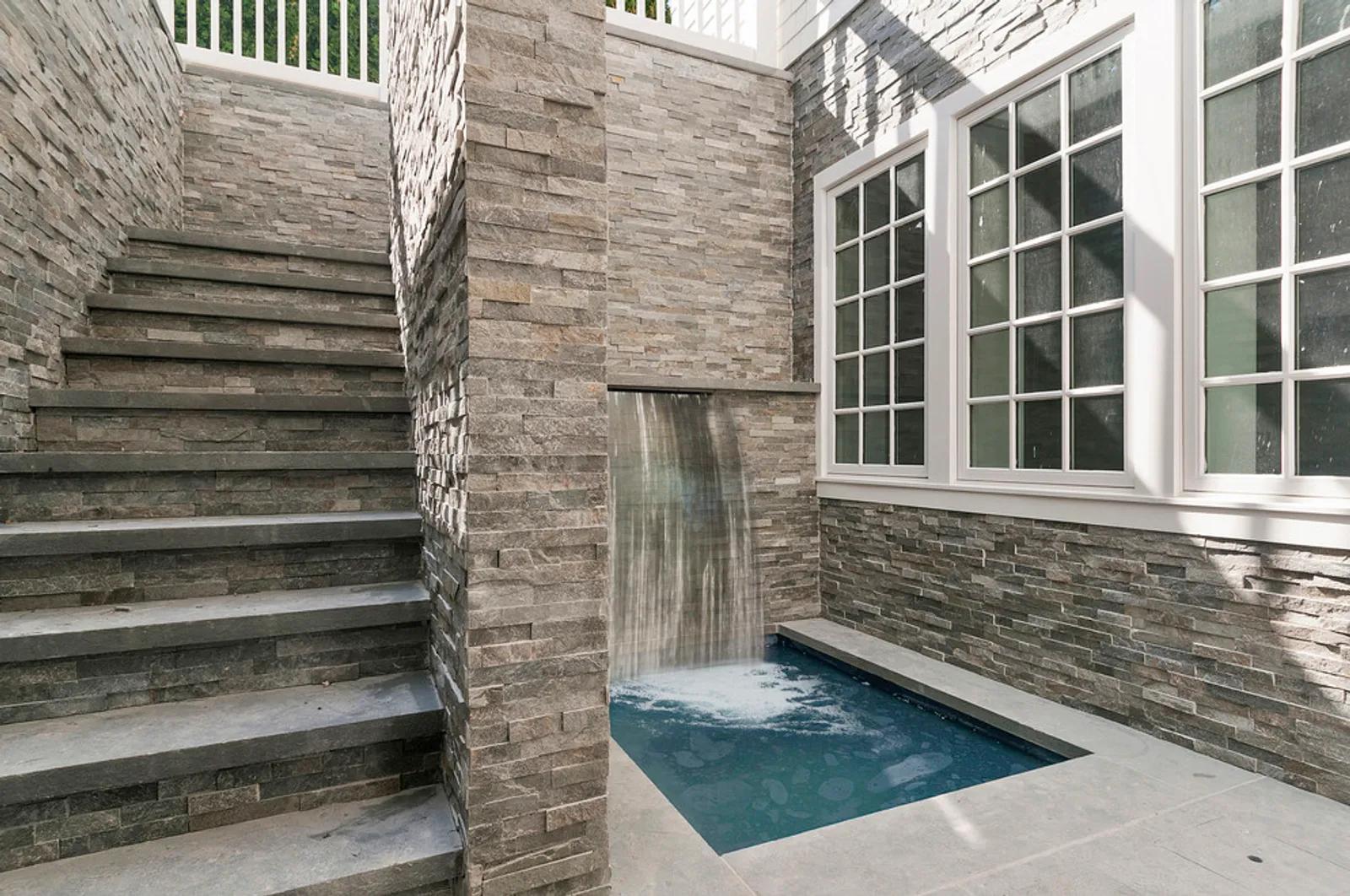 The Hamptons Real Estate | View  | Lower Level Spa With Waterfall | View 16