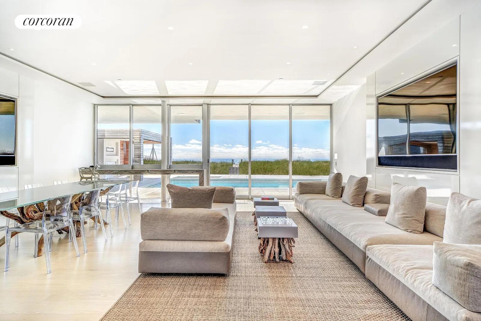 New York City Real Estate | View 277 Surfside Drive | pool level living room | View 6