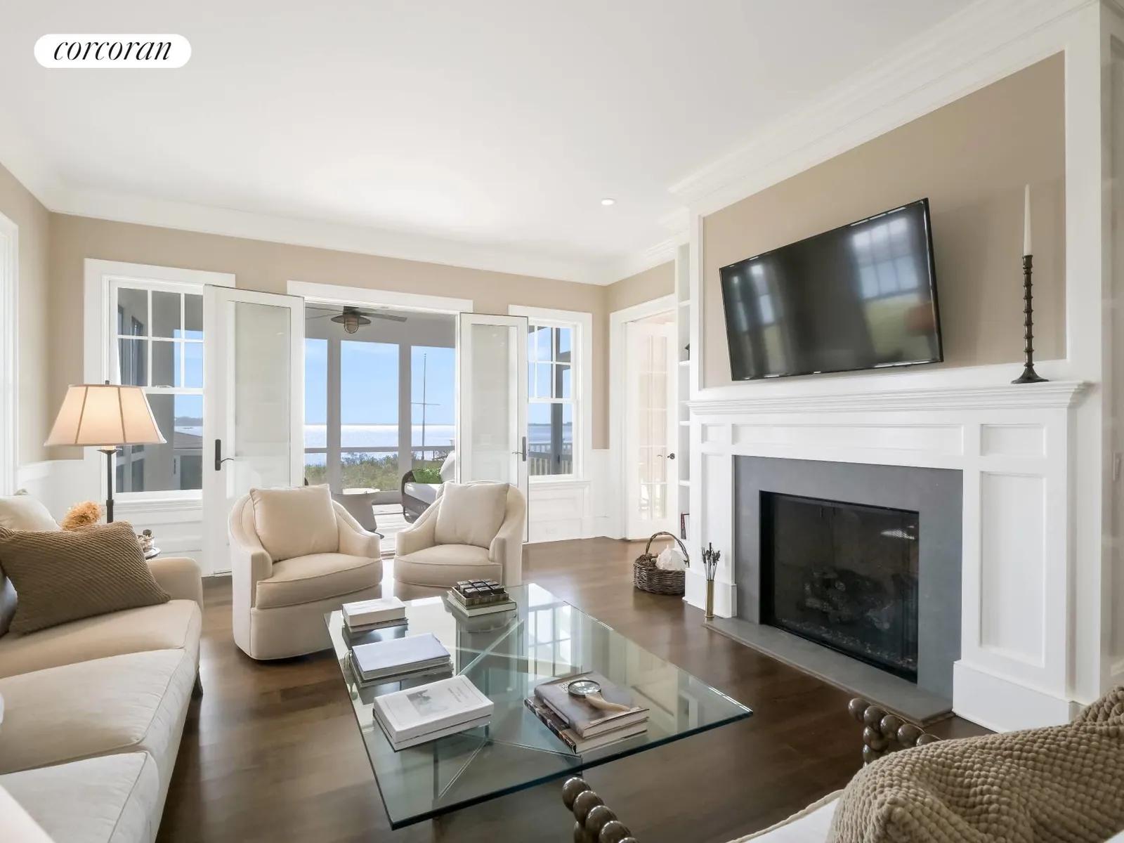 The Hamptons Real Estate | View 541 Main Street | Library with Fireplace | View 12