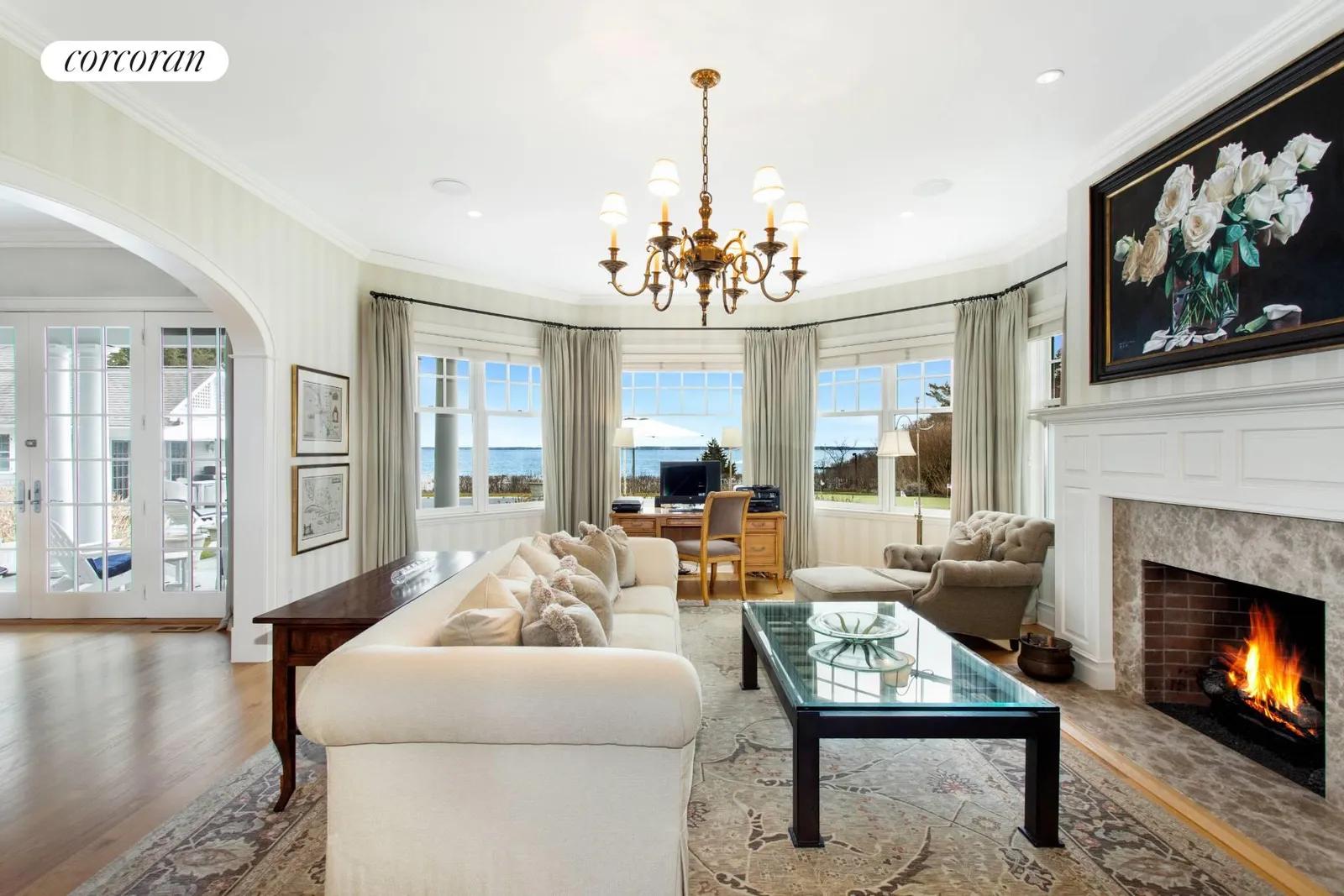 The Hamptons Real Estate | View 2503 Camp Mineola Ext | Living Room w. FPL | View 9