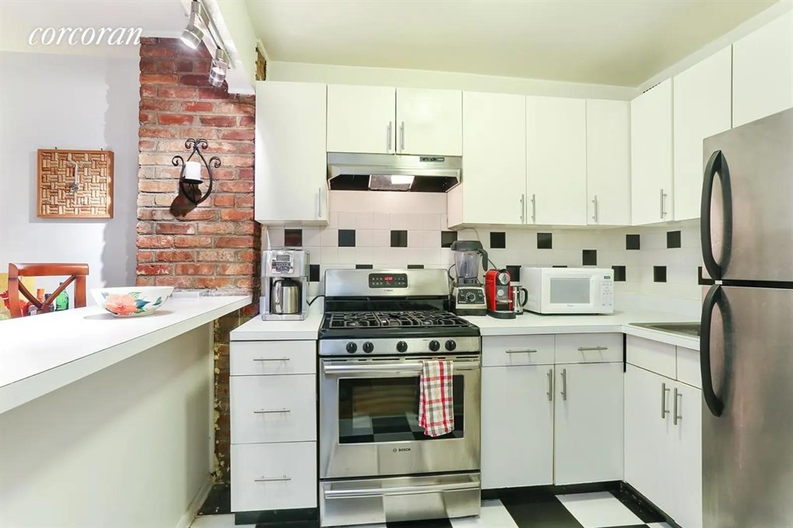 New York City Real Estate | View 314 West 56th Street, 2C | Open Kitchen with Breakfast Bar! | View 3