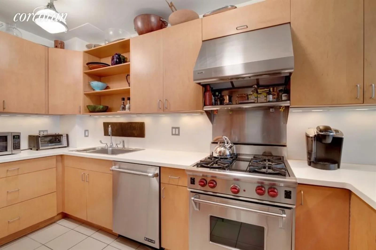 New York City Real Estate | View 151 East 37th Street, 3-4 | Modern Kitchen with Breakfast Bar | View 3