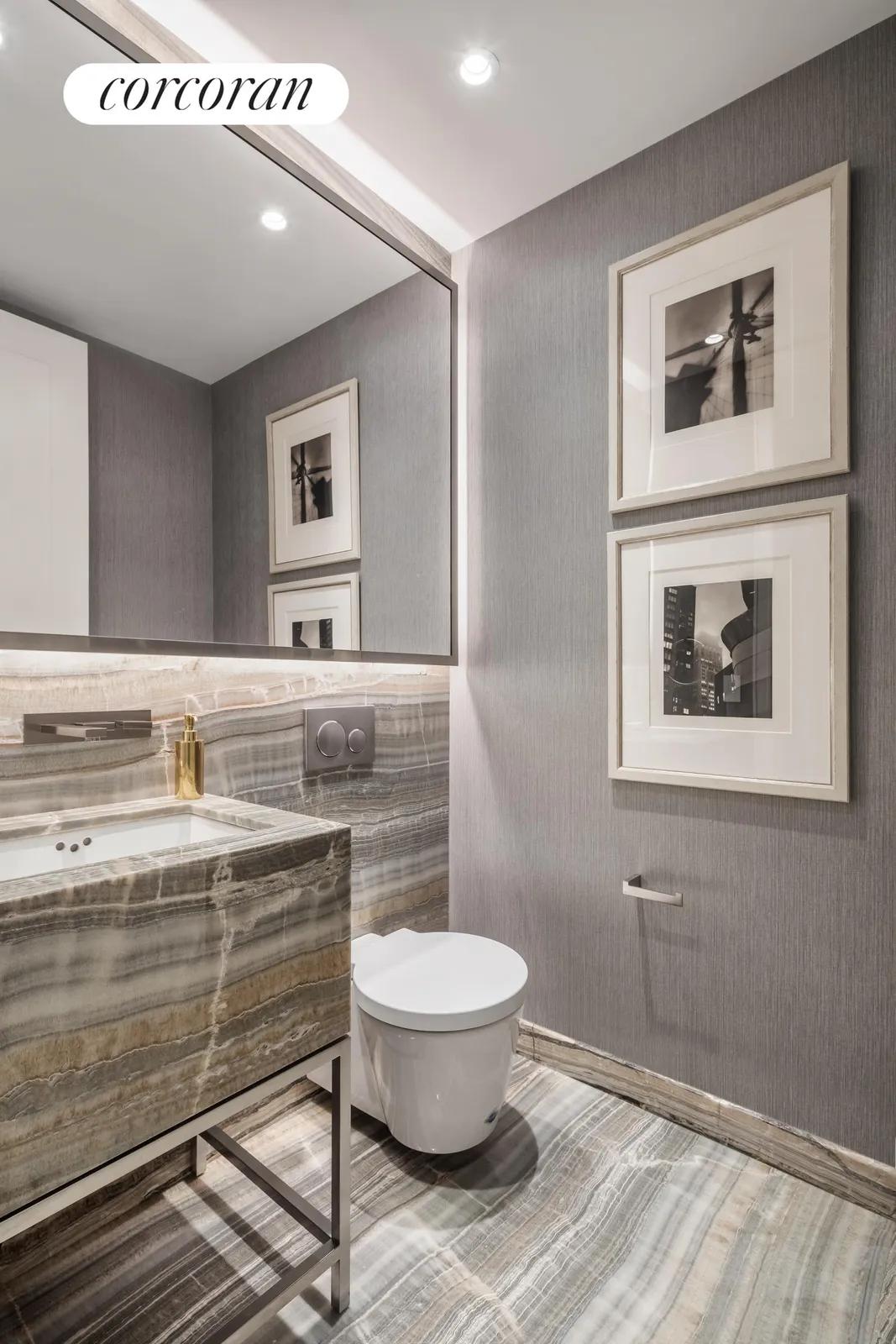 New York City Real Estate | View 70 Vestry Street, 3F | Powder Room with custom designed onyx vanity | View 7