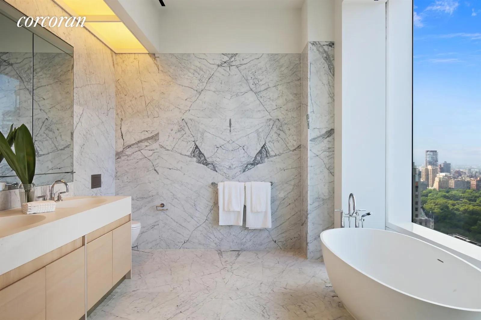 New York City Real Estate | View 432 Park Avenue, 39D | Master Bathroom with Central Park Views | View 7