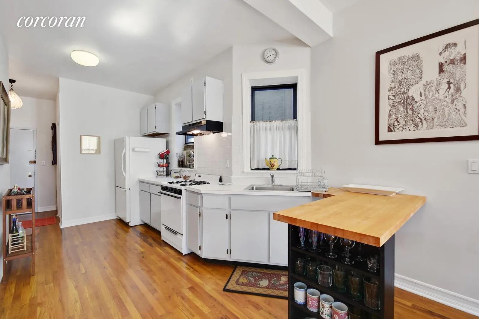 New York City Real Estate | View 7 East 3rd Street, 13 | Kitchen with breakfast bar | View 5