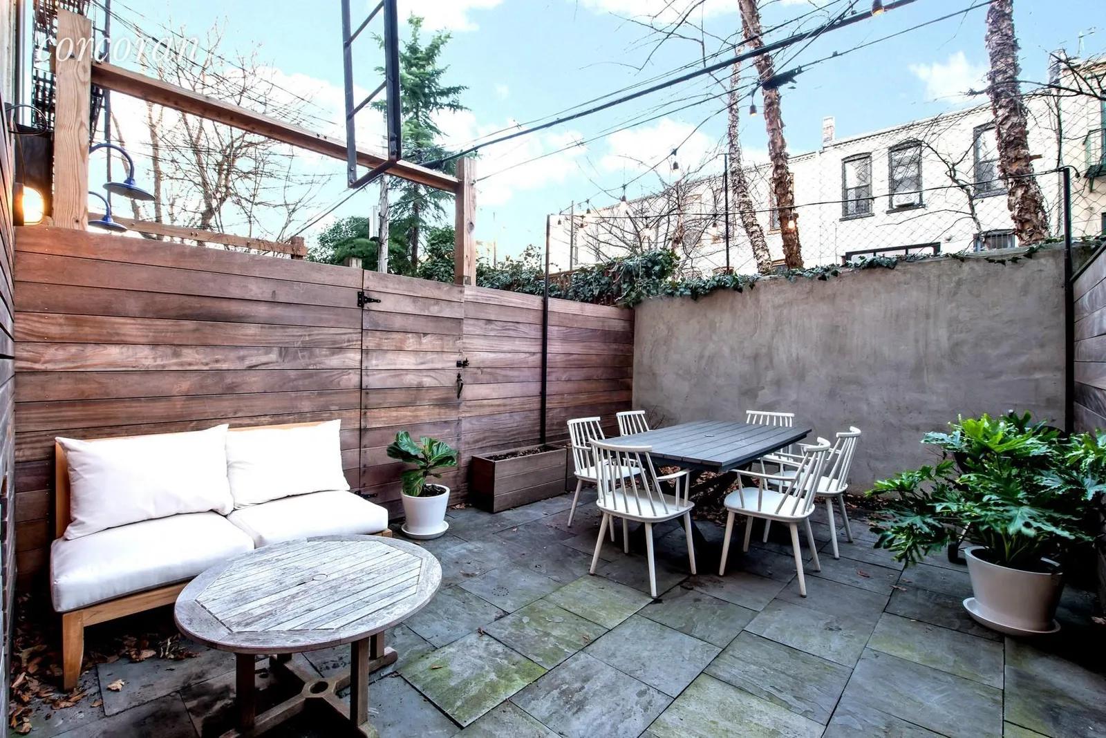 New York City Real Estate | View 497 12th Street, 1R | Private garden with bluestone pavers & ipe fencing | View 8