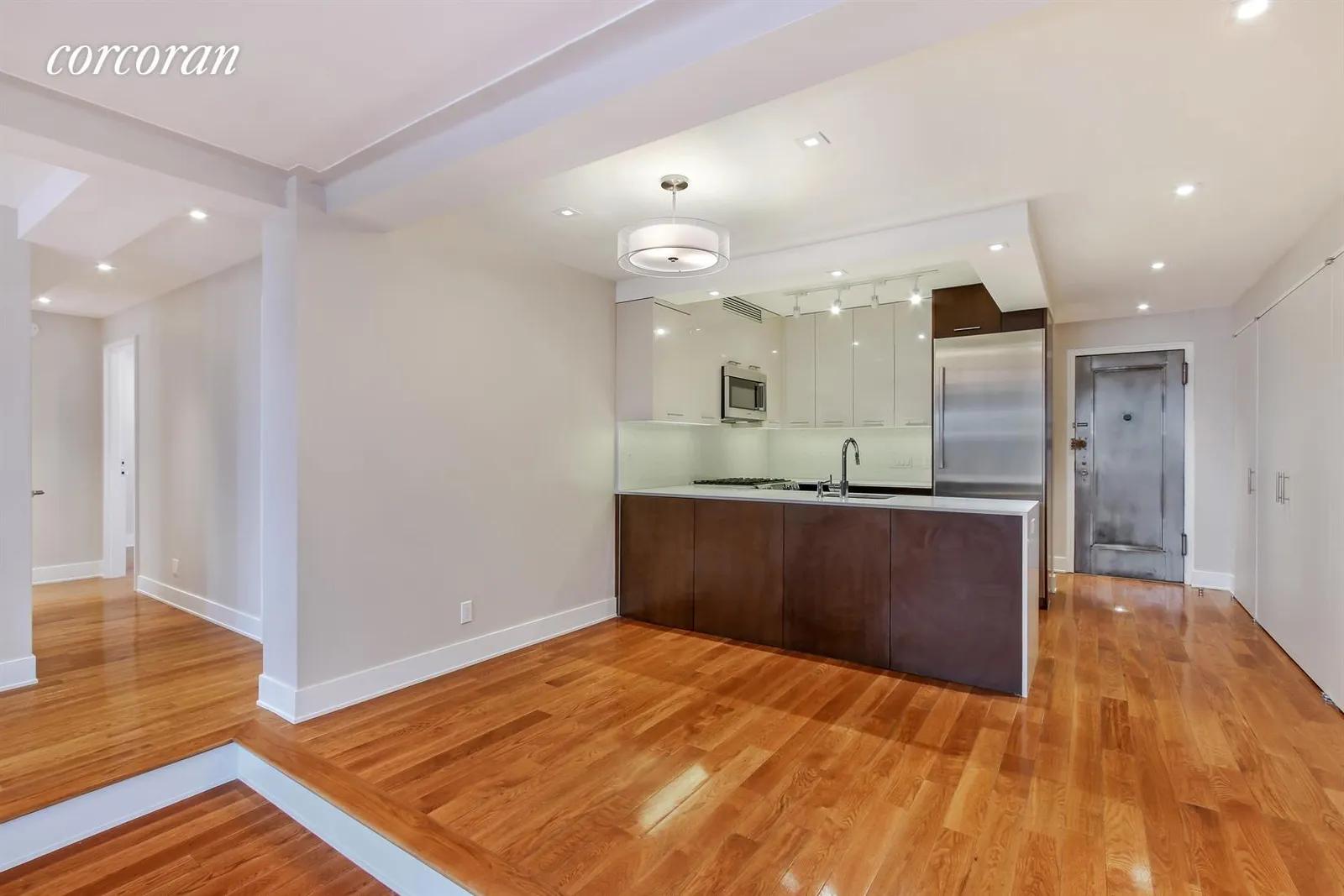 New York City Real Estate | View 29 West 65th Street, 4HJ | Dining Area, Modern Kitchen, Hallway to 3 Bedrooms | View 7