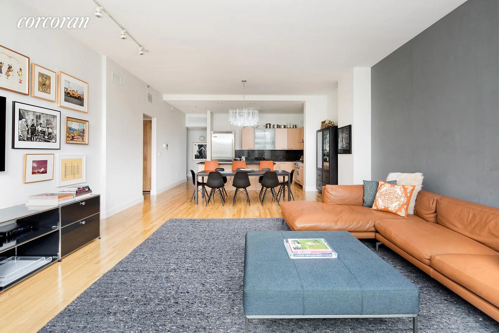 New York City Real Estate | View 121 West 19th Street, 7B | 27' long great room with open kitchen and dining | View 2