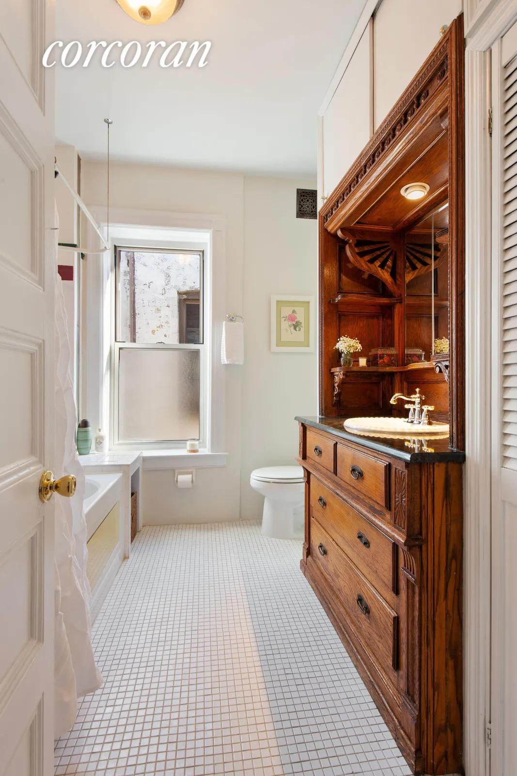 New York City Real Estate | View 808 8th Avenue, 4R | Master Bathroom with Built-In Antique Vanity | View 6
