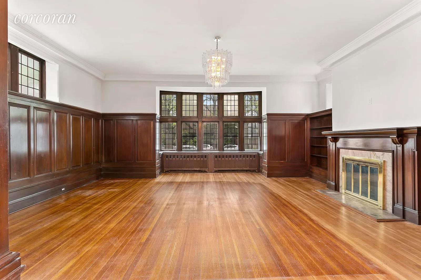 New York City Real Estate | View 1712 Ditmas Avenue | The paneled Great Room with original fireplace | View 3