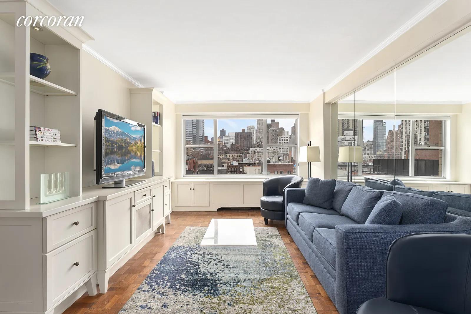 New York City Real Estate | View 230 East 79th Street, 10A | Close up of living room and oversized windows | View 2