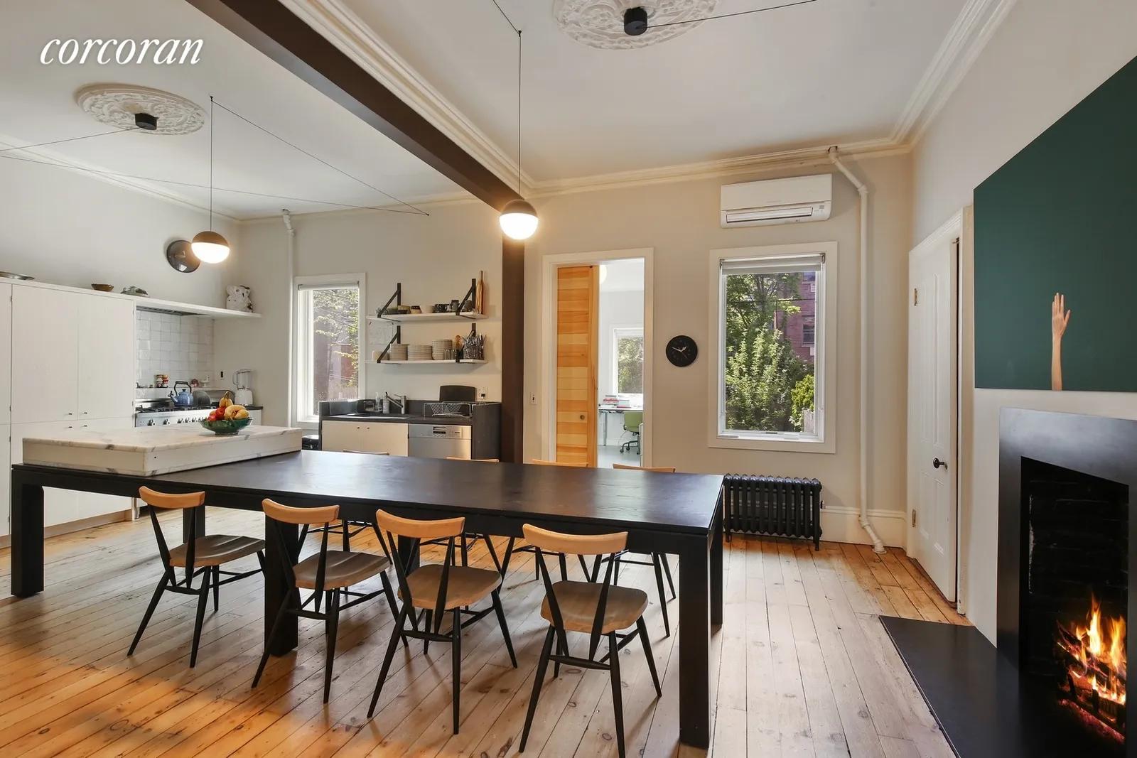 New York City Real Estate | View 163 Eckford Street | KITCHEN WITH TABLE FOR TEN & GAS FIREPLACE | View 2