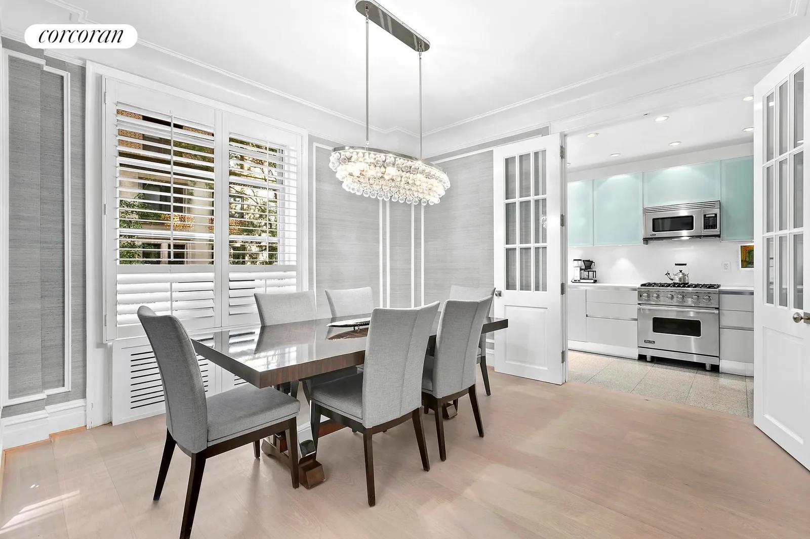 New York City Real Estate | View 780 West End Avenue, 2A | French glass doors open to renovated kitchen | View 4