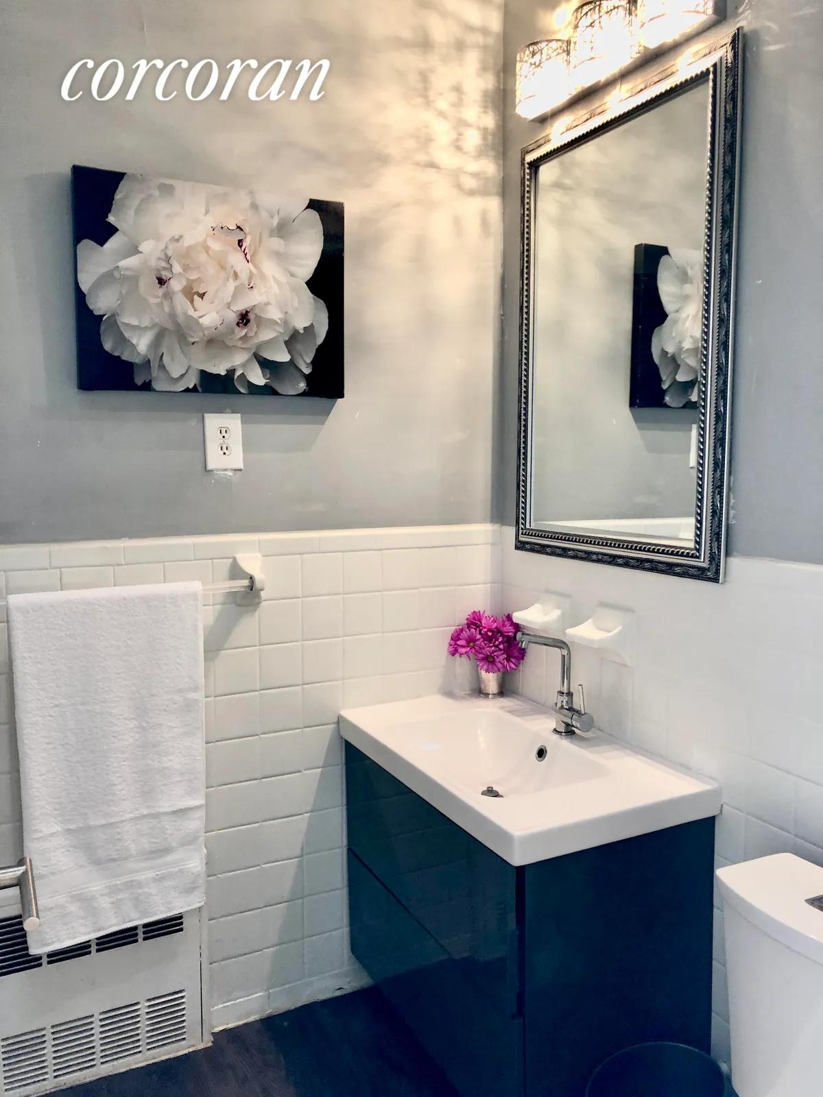 New York City Real Estate | View 441 76th Street | Upstairs renovated bathroom | View 17