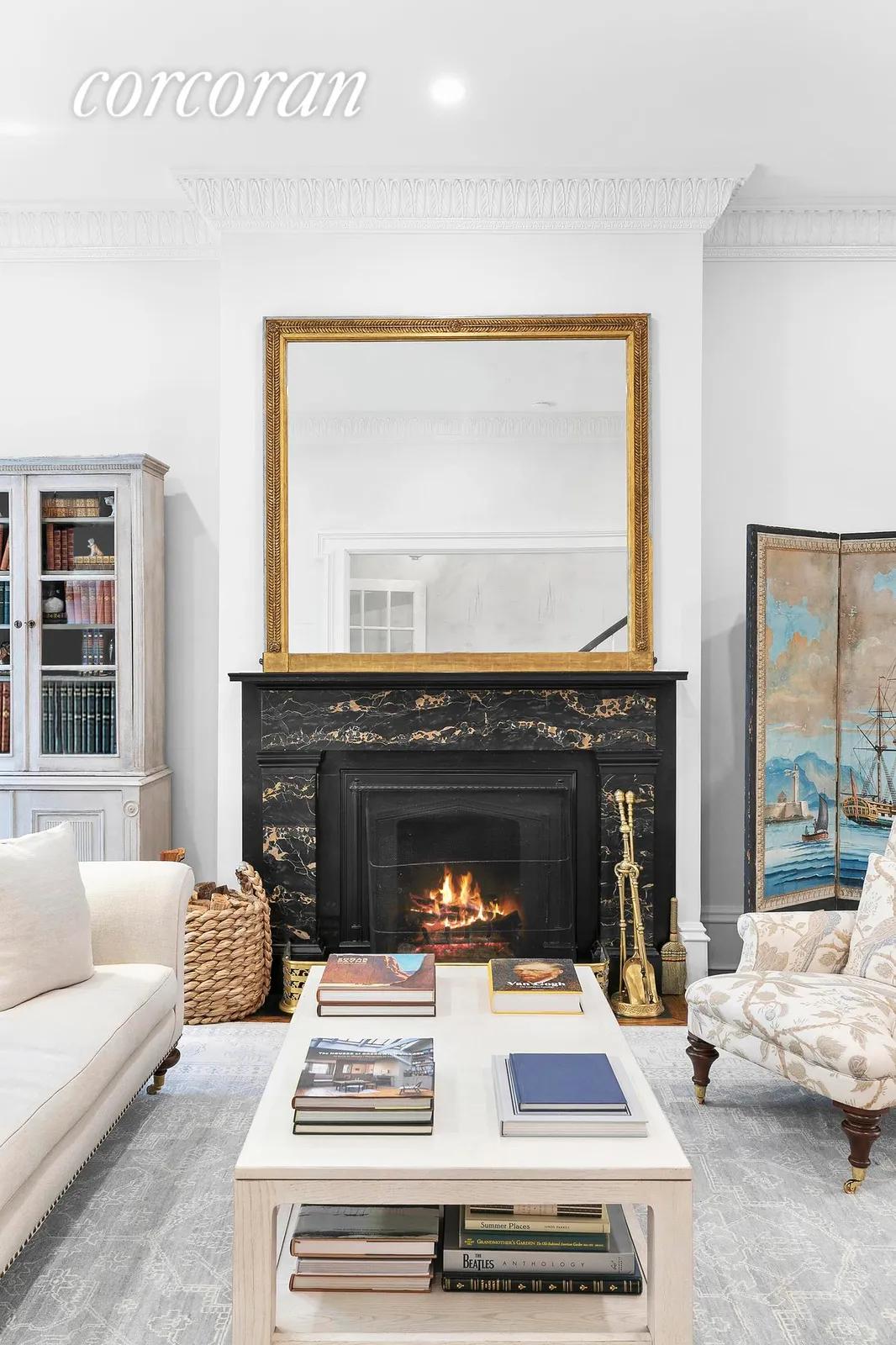 New York City Real Estate | View 32 Perry Street | Living Room Fireplace | View 15