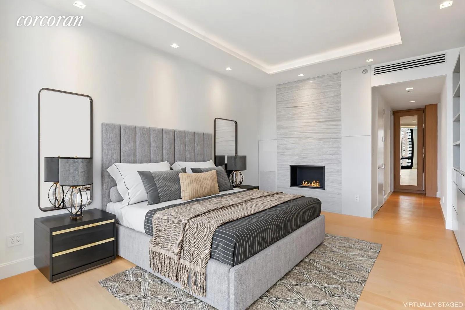 New York City Real Estate | View 101 Warren Street, 2420 | Primary Bedroom with Fireplace | View 9