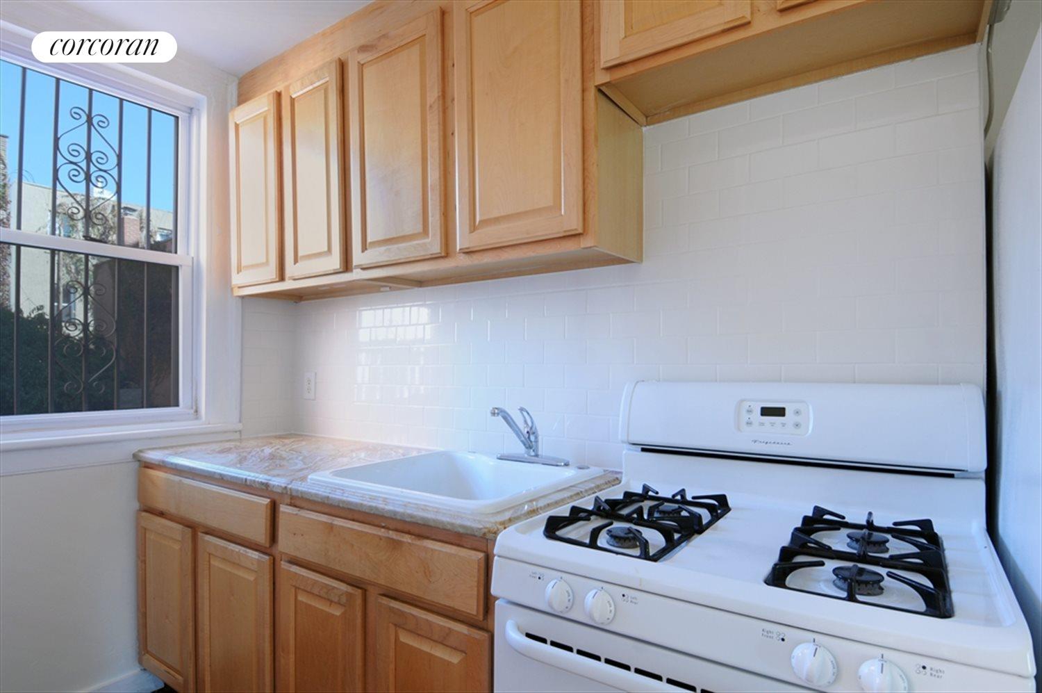 New York City Real Estate | View 259 8th Street, Duplex | new marble counter and subway- tiled backsplash | View 3