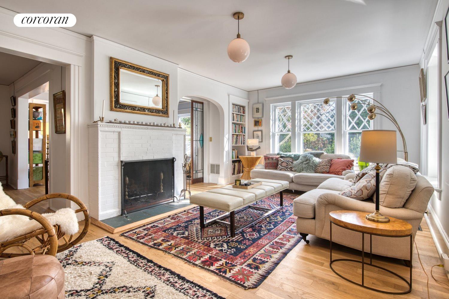 The Hamptons Real Estate | View 151 North Ferry Road | Living room with fireplace | View 9