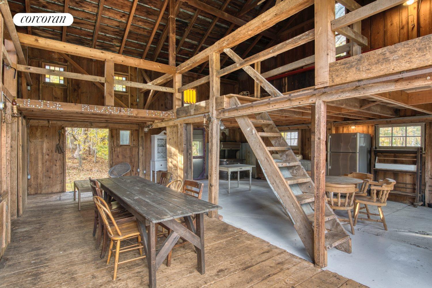 The Hamptons Real Estate | View 151 North Ferry Road | Barn interior with loft and bath | View 28