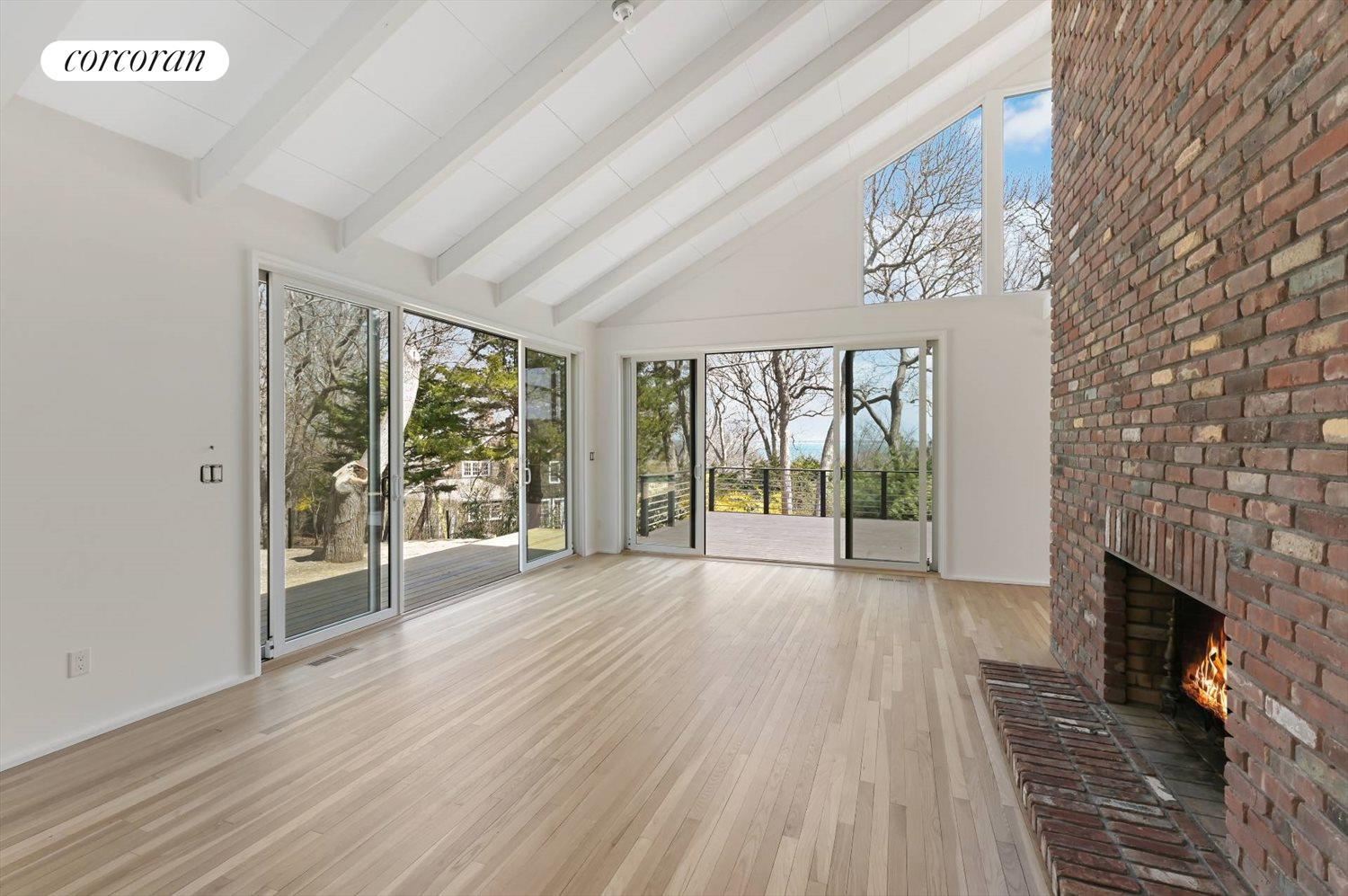 The Hamptons Real Estate | View 49 Windward | Living Room w/ Fireplace | View 5